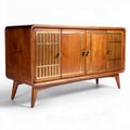 Mid-century modern wooden sideboard with brass accents and storage space
